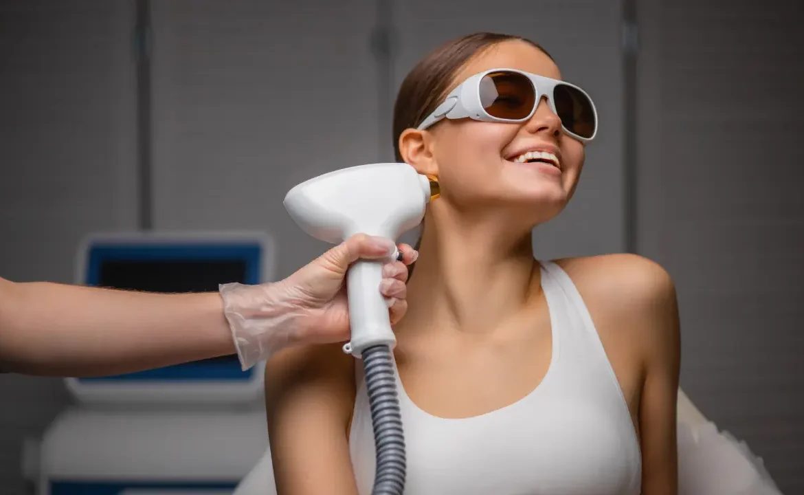 A young girl with white top is getting the treatment of laser hair removal at black diamond medical center